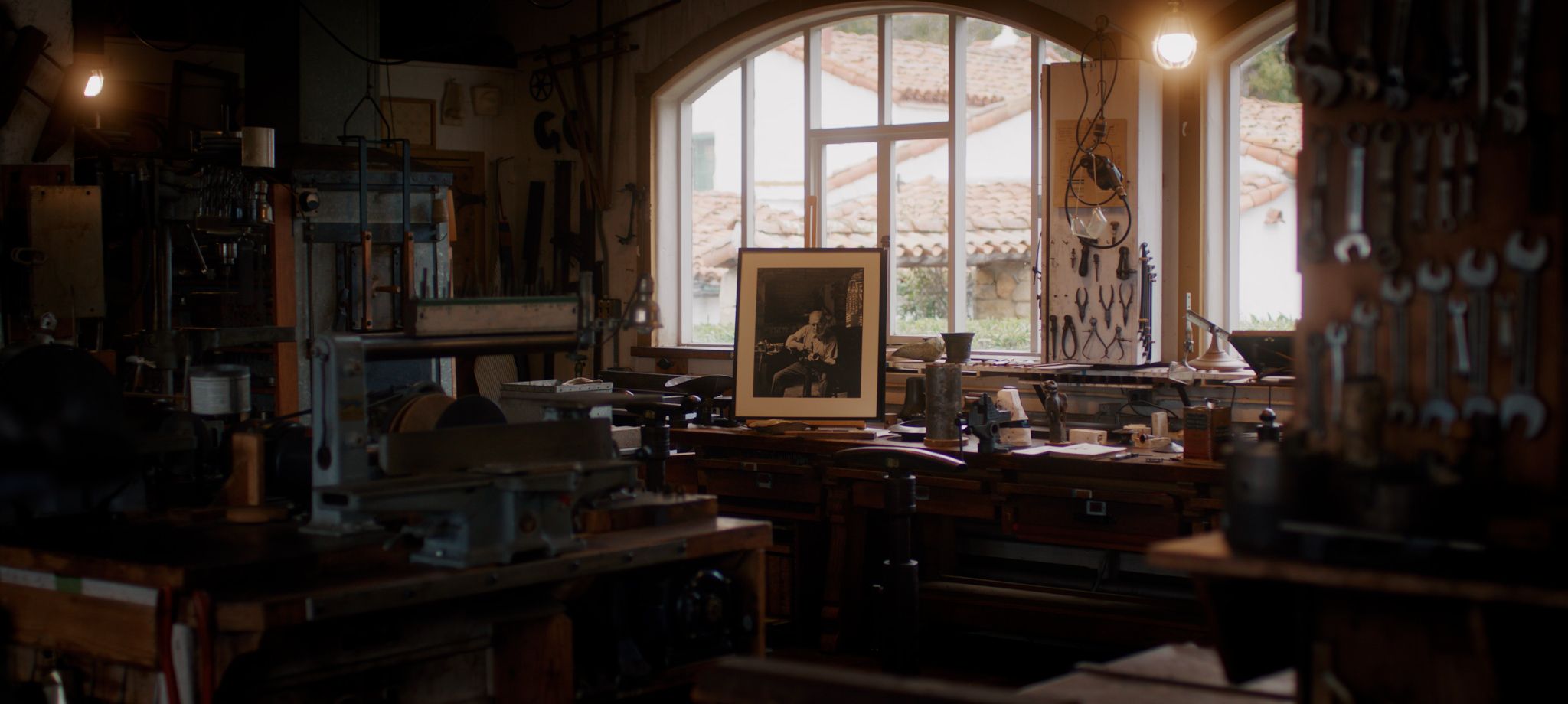 Inside of a darkened room at Santa Barbara's Casa del Herrero where everything a blacksmith needs is being displayed.